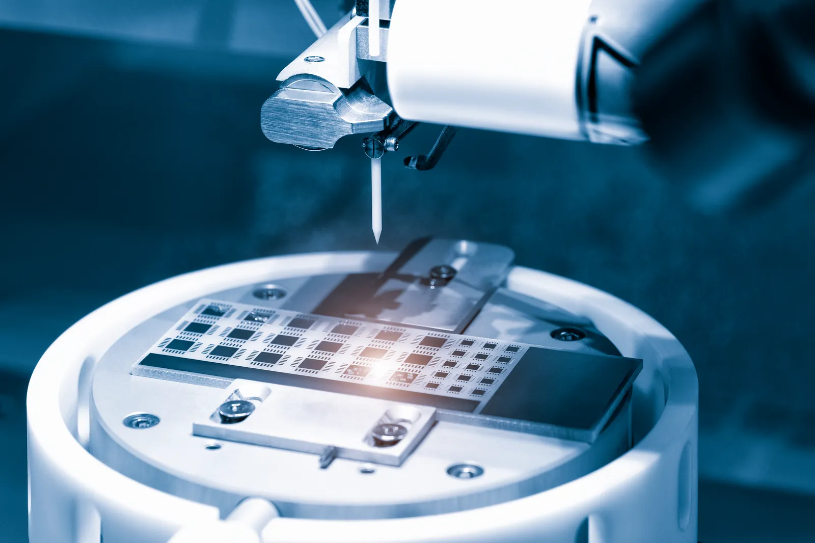 Microchip transistor sample examined under a microscope in a laboratory
