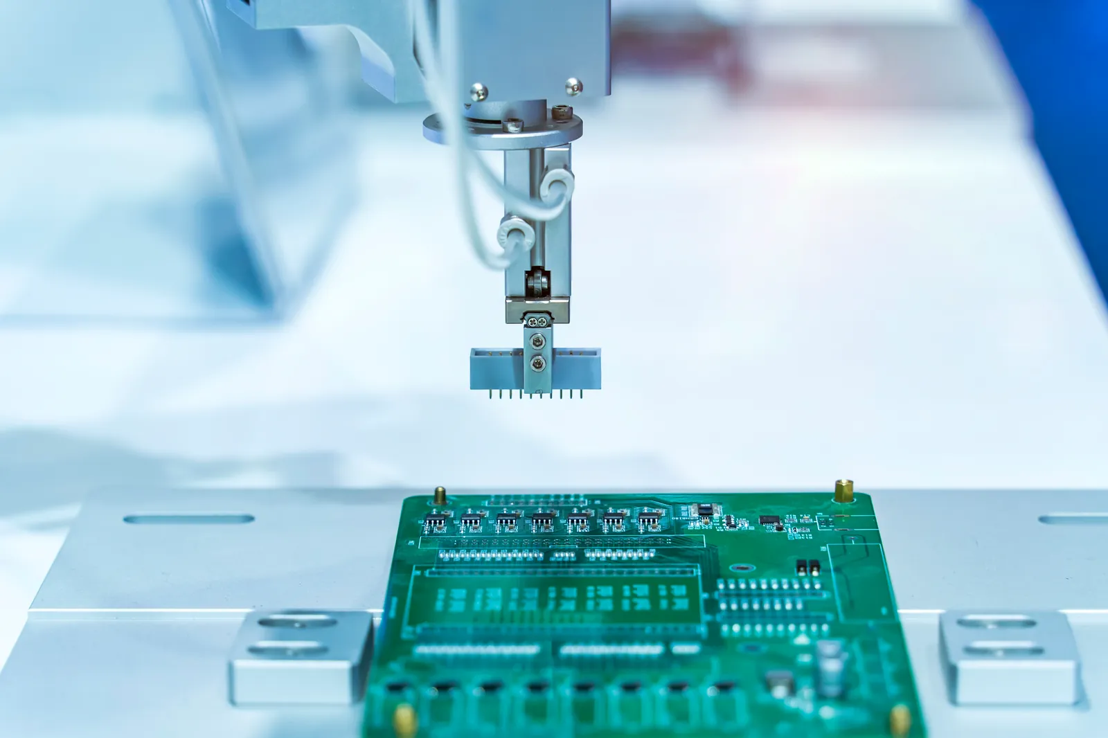 Automatic robot performing printed circuit board assembly and soldering in a factory
